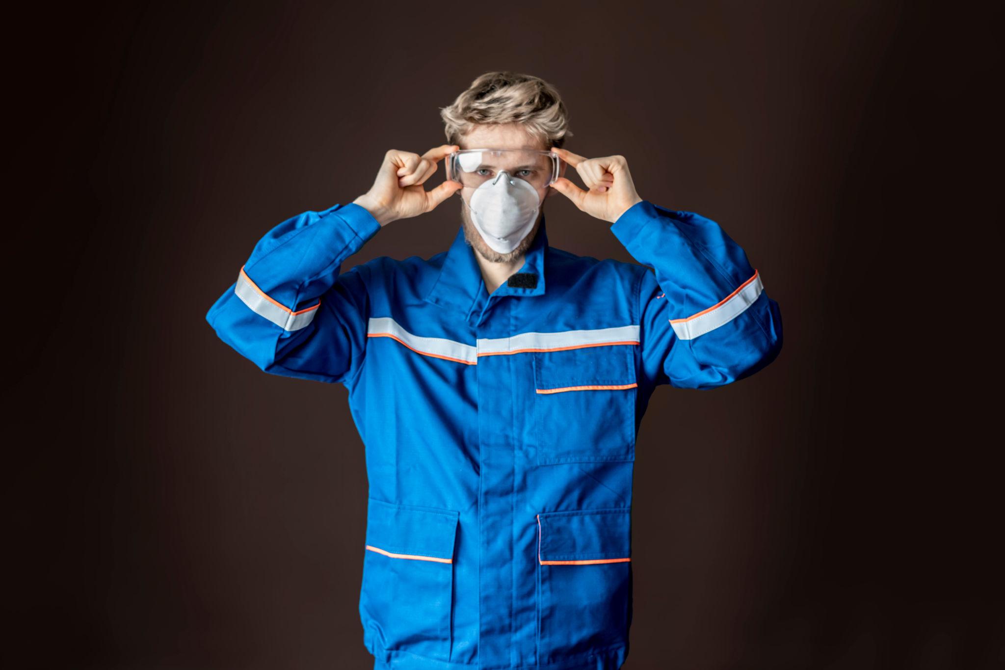 worker wear protective gear. precaution measures concept b