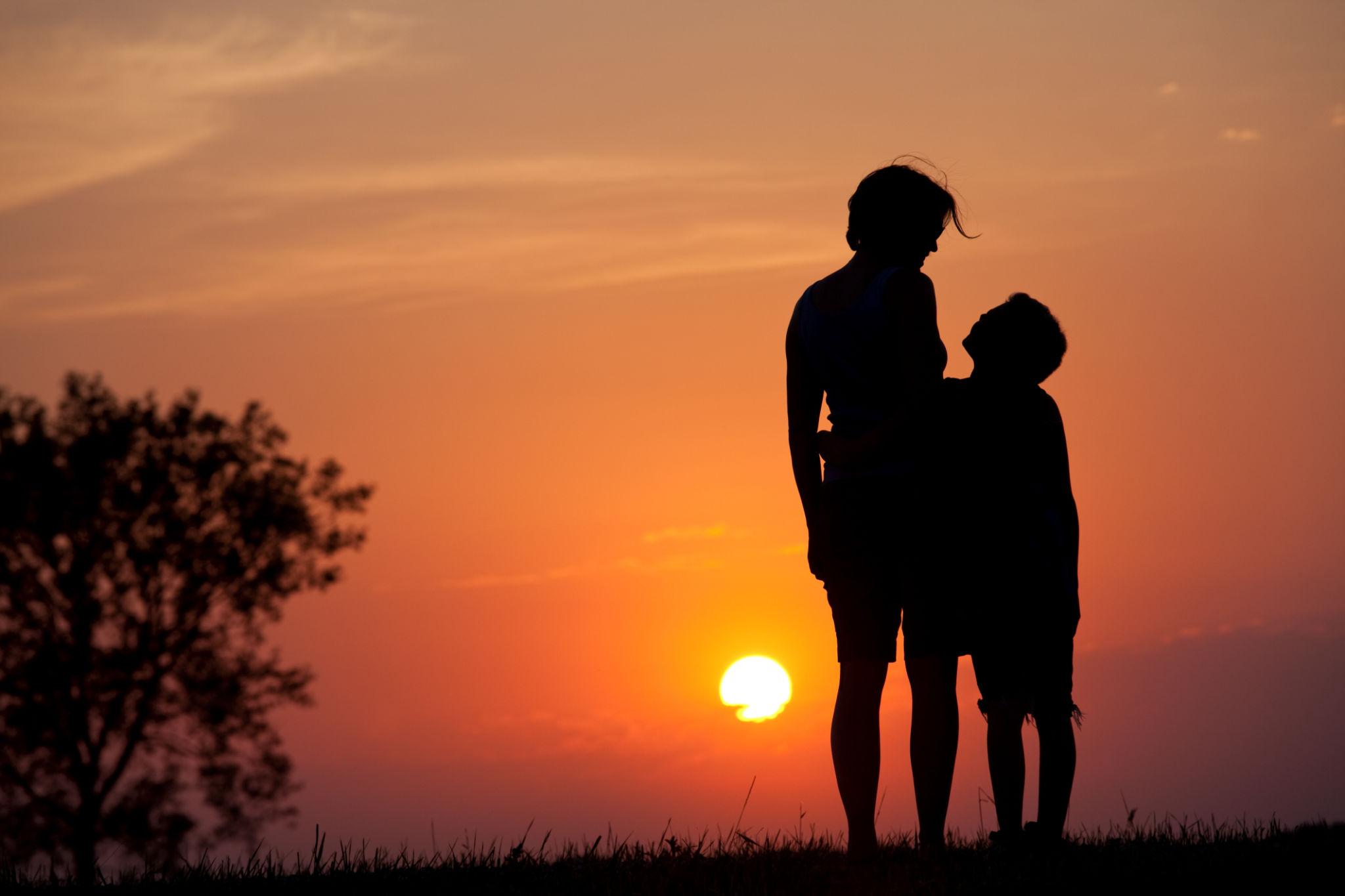 Silhouette of Woman and Child Bonding