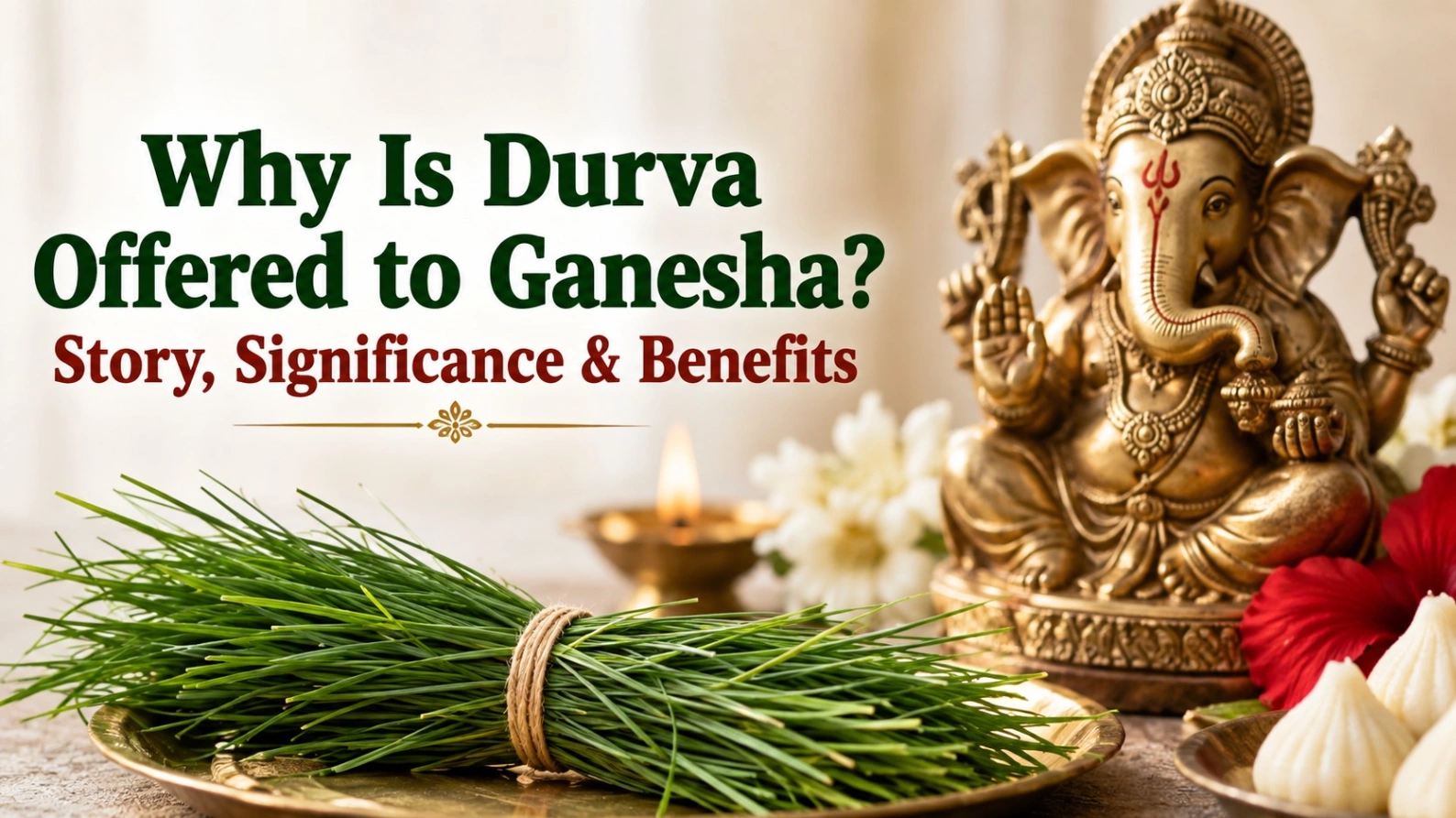 : Lord Ganesha idol with fresh Durva grass, diya, flowers and modaks, illustrating why Durva is offered to Ganesha and its spiritual significance.